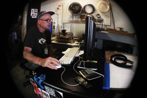 City College graphics arts student, Chris Currier, edits his film in his studio; the film will be entered in the 48 Hour Film Festival.