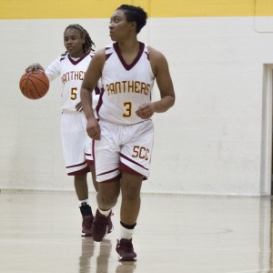Freshman guard Rayelle Ross (right) and sophomore Lakeiya White search for an answer for the San Joaquin Delta College Mustangs as would their fellow team Panthers Feb. 18. The Panthers suffered a 29-point loss for a final score of 73-44. Teri Barth | Online Editor in Chief | express.teri.barth@gmail.com