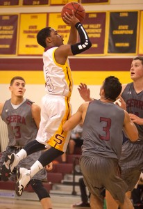 Kellen HIll, City College freshman guard, jumpshot goes down for two points as Seirra College freshman teammates Isaiah Pinerio (left), forward, Devin Moss, guard, and Isiah Quintero, center, can only watch in the second half at the North Gym on Jan. 27th.   Dianne Rose/dianne.rose.express@gmail.com