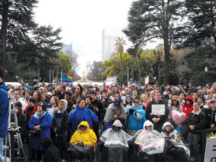 Despite the rain, a large crowd turned out to speak out against Proposition 8.