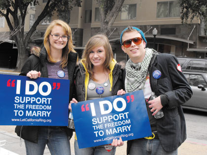 Violet Hill, Michelle Hoffman and Erik Speer, show their support for gay marriage. “I’m here to demonstrate my right to speak my mind and here to promote equality,” said Speer.