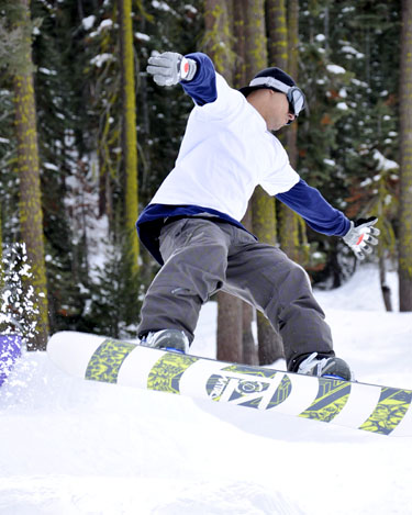Elliott, a visiting snowboarder, performs a 360 manuever Feb. 28 while speeding down a run at Sierra-at-Tahoe. photo by Jana Hendler