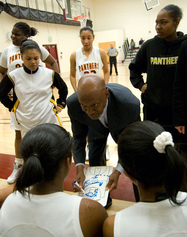 City College women’s basketball coach David Carmichael gives a pep talk Feb. 10 to his team during the first quarter against San Joaquin Delta College in North Gym. photo by Robert Paul