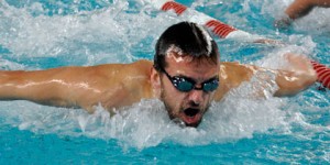 <h5>City College men’s swimmer John Cooper shows what the butterfly is all about Feb. 13 while competing against American River College at Hoos Pool</h5>