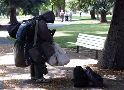 A homeless man gathers his belongings April 19 in Capitol Park.