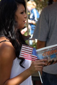 Nursing student Tara Cervantes, 17, holds an American flag while enjoying the festivities at the annual Constitutional Day event on the City College Quad. || Randy Briggs || briggsr@imail.losrios.edu