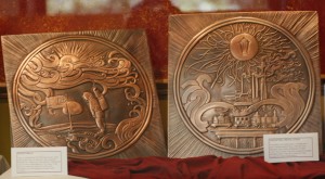 "Moon Walk" and "Industrial Revoluton" are two of six hand-signed and numbered copper relief panels by Hungarian artist Rudolf Haynal on display in Rodda Hall North, second floor.