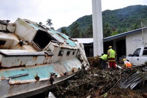 A boat and trash sit in the front parking lot of a church after a tsunami caused a great amount of structural damage to the island and its villages Oct. 1, 2009, in Pago Pago, American Samoa . (U.S. Air Force photo/Tech. Sgt. Cohen A. Young)