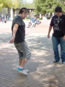 Gabe Moctezuma, theater arts major, and Felipe Riviera, electrical engineering major, get together for a pick-up round of Hacky Sack during a break from their classes.