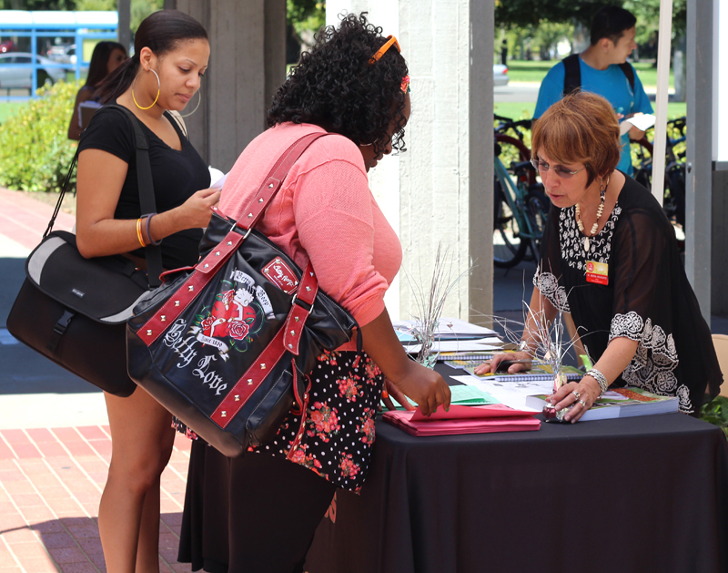 PICTURE OF THE DAY Aug/28/12-Angela Ball, 25, Psychology major, and Latricia Emerson, 25, Nursing major, are getting directions at the west entrance of the campus  from  Rhonda Rios Kravitz, Dean of the Learning Resources Center.  Evan E. Duran | evaneduran@gmail.com