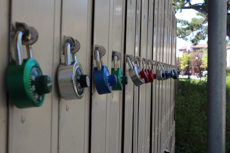 A+row+of+lockers+with+multi+colored+locks+attached.