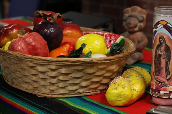 PICTURE OF THE DAY-Oct. 30, 2012. Fruit, sweet bread, and candles are some of the offerings left out for the departed spirits of loved ones are part of a Dia de Los Muertos presentation inside the Cultural Awareness Center given by David Rasul, Dean of Counseling. Evan E. Duran | evaneduran@gmail.com