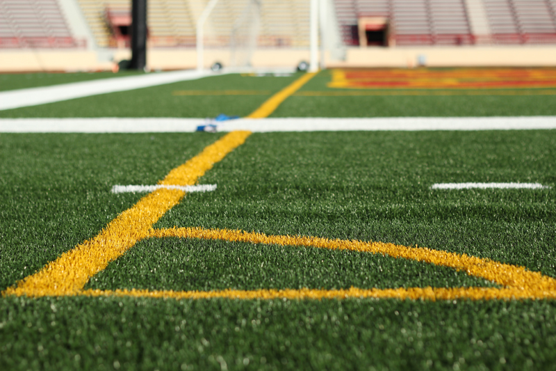 The lines painted on Hughes Stadium feild are to accomodate both football and soccer.  Evan E. Duran | evaneduran@gmail.com