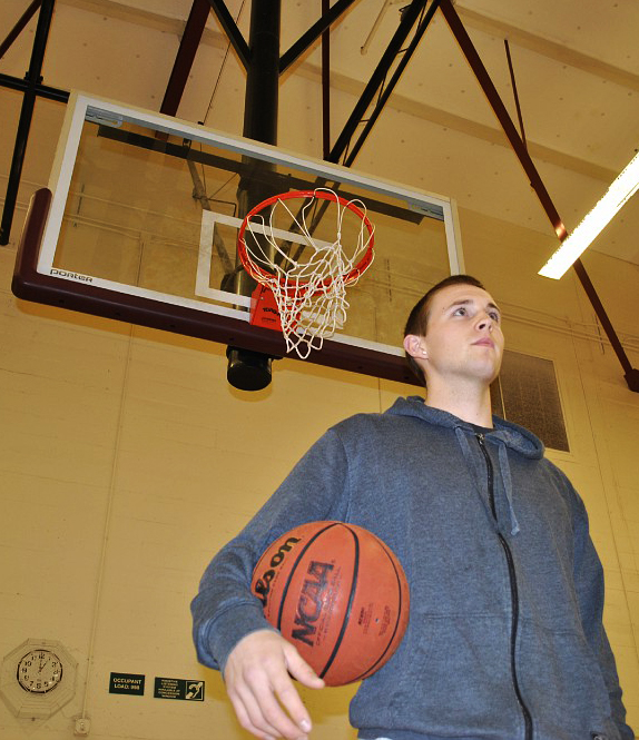 Jordan+Coen-Kotecki+holding+basketball+at+his+side+on+the+City+College+court.