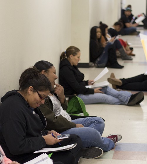 Students wait in the hallways before taking finals.