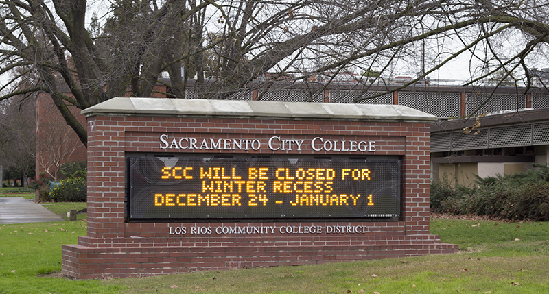 A digital sign at Sacramento City College that reads SCC will be closed for winter recess December 24 through January 1.