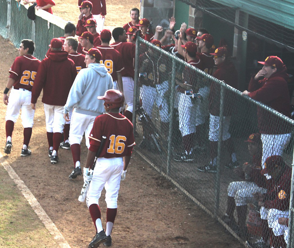 Panthers high-five and watch in suspense after scoring a run in a previous game against the Fresno City Rams. A win over Chabot College on Feb. 8th brought their conference record to 2-3. | T.William Wallin | wallintony@yahoo.com