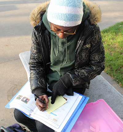 Dawn Brooks, undecided major, finishes her Spanish homework in the quad. | Harold Williams | dtectivedan2@yahoo.com