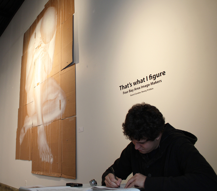 Vasiliy Savchenko, front desk attendant for the Kondos Gallery, works on a drawing while waiting for art appreciators to come to see the gallerys latest exhibit Thats what I figure. | Angelo Mabalot | acmabalot@gmail.com