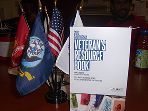 The 2012 California Veteran's Resource Book and numerous military flags are set up in the veteran resource center for student veterans to reference. | Raionna Nasmyth | raionnadymond@gmail.com