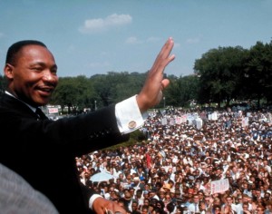Dr. Martin Luther King Jr. waves to the crowd at the National Mall in Washington, DC, August 28, 1963. (Photograph by Francis Miller // Getty Images)