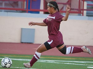 Mai Chang, sophmore defender, kicks at the home match against American River College at Hughes Stadium on Oct. 1.//Dianne Rose/ Multimedia Editor/ dianne.rose.express@gmail.com