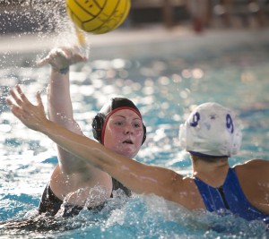 Melissa Wall, City College sophomore, utility, goes passes the ball during the home match Oct. 30 against Modesto Junior College at Hoos Pool. Dianne Rose | multimedia editor | dianne.rose.express@gmail.com