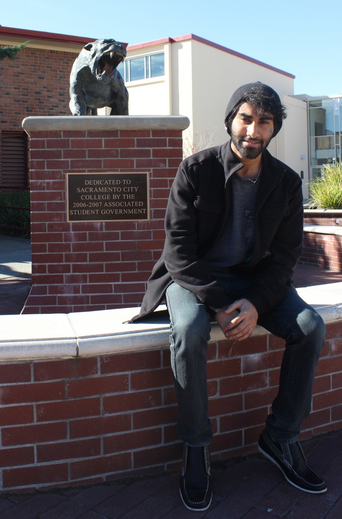 Sandeep+Singh%2C+president+of+the+City+College+Student+Senate%2C+takes+a+break+by+the+student+government+placard.