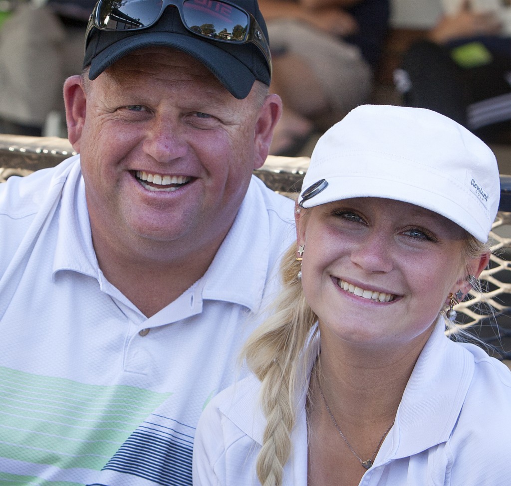 City College freshman Madison Holmwaits with her father, Martin Holm after finishing her round during the Jan High Memorial tournament at the Bing Maloney Golf Course in October.