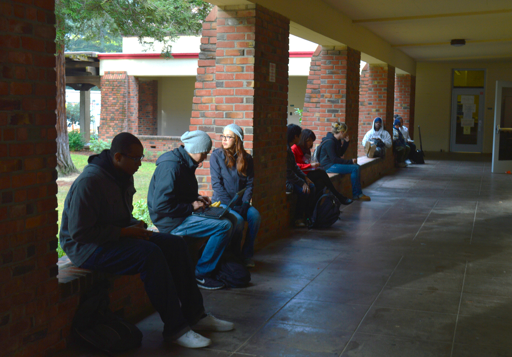 Students relax Jan. 29 on the brick the wall just outside the Preforming Arts Center. Emily Foley | Staff Photographer