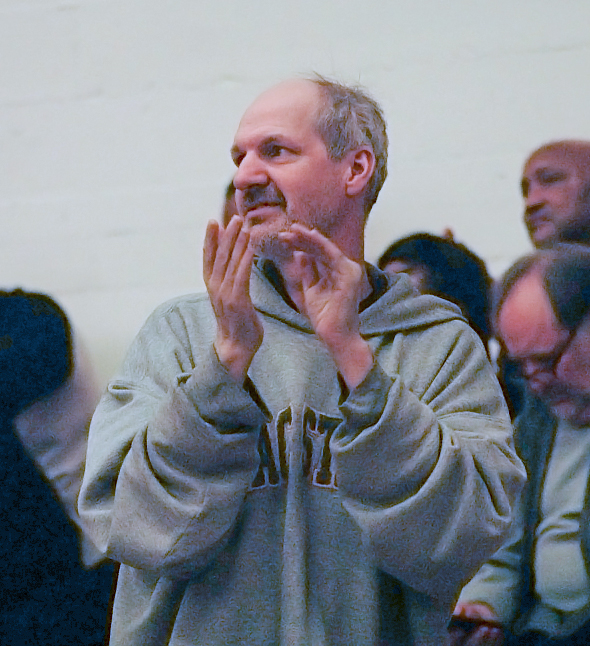 Randy Hicks applauds at a City College men’s basketball game Feb. 21. Hicks has been attending games since 1998.