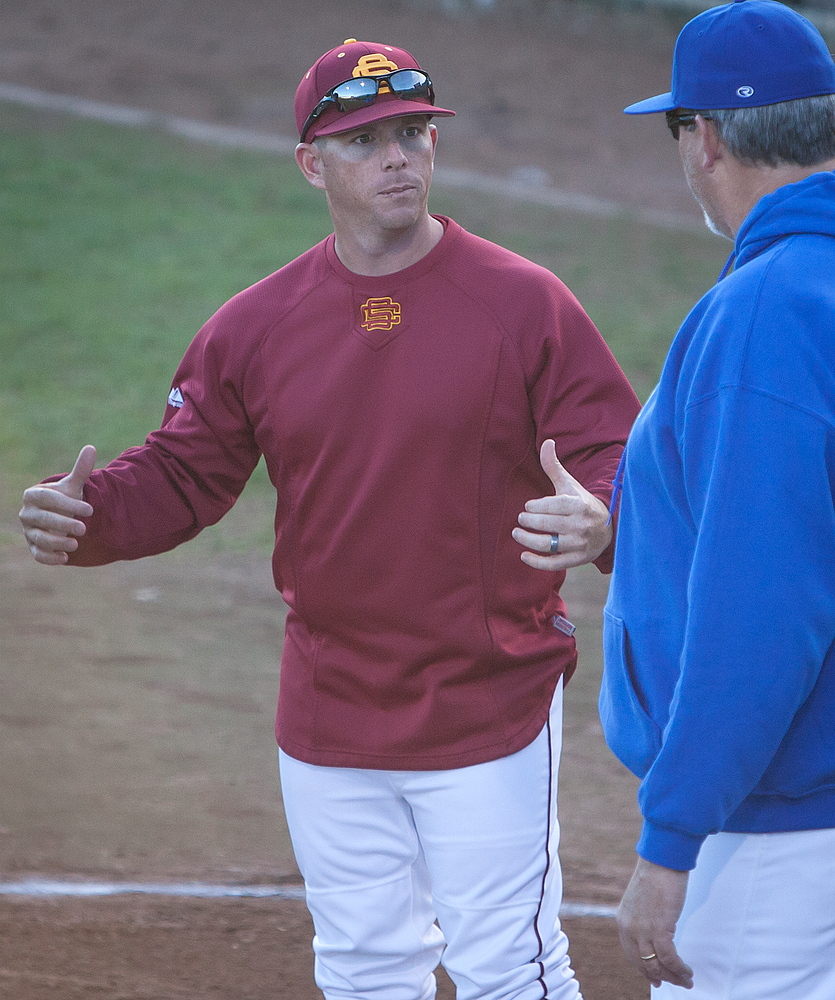 City College head baseball coach Derek Sullivan meets with an opposing coach before a game at Union Stadium March 1. Dianne Rose | Staff Photographer | dianne.rose.express@gmail.com