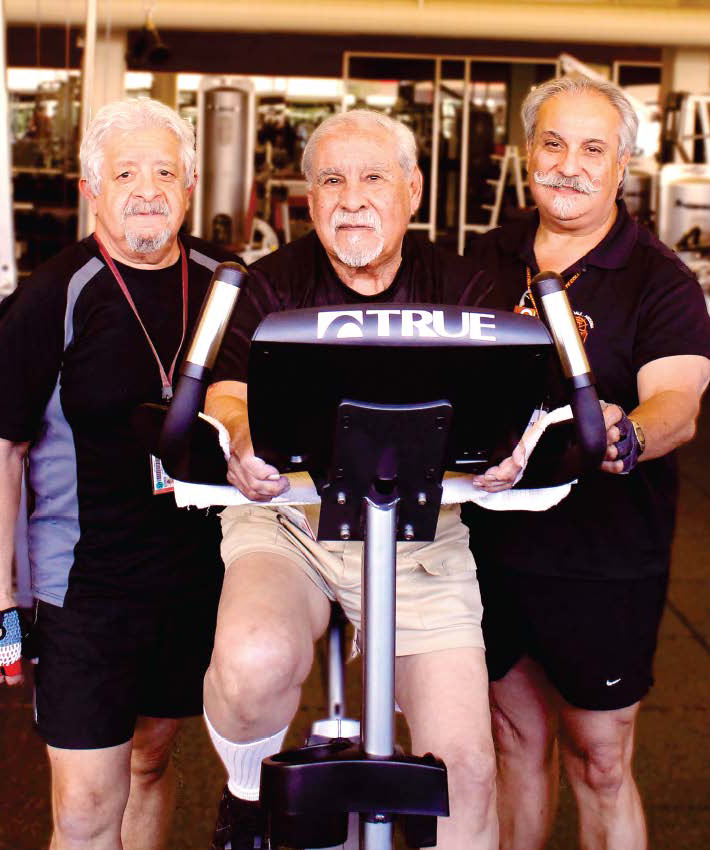 From left to right, Victor Sr., Victor Jr., and Gilbert Lagunas exercise in City College’s North Gym