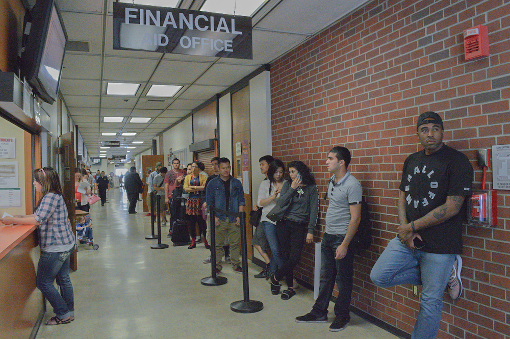 City College students wait in line in Rodda North May 12 for their turn at the Financial Aid window to discuss matters pertaining to their individual costs for higher education. Luisa Morco | Staff Photographer | luisamorco.express@gmail.com