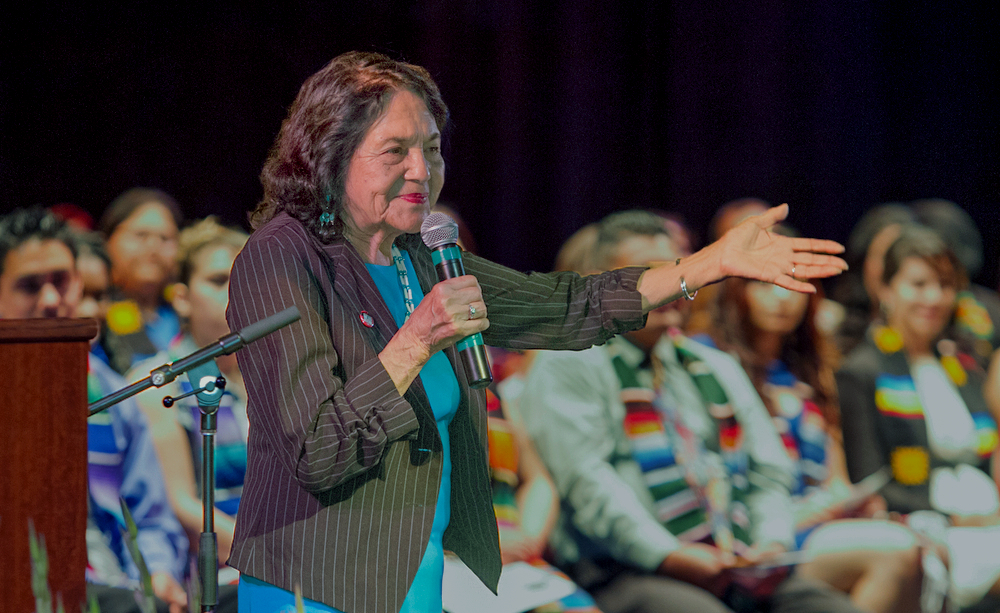 Activist and labor leader Dolores Huerta speaks to graduating students May 7 during the Honorando a Nuestros (Honoring Students) event in the Performing Arts Center. Photo by Tamara M. Knox l Online Photo Editor l tmrknox@gmail.com