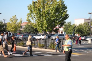 Campus safety officer Eric Delgado directs traffic  as students go to class on Monday morning September 8, 2014. Staff photographer| James Bergin <span id=