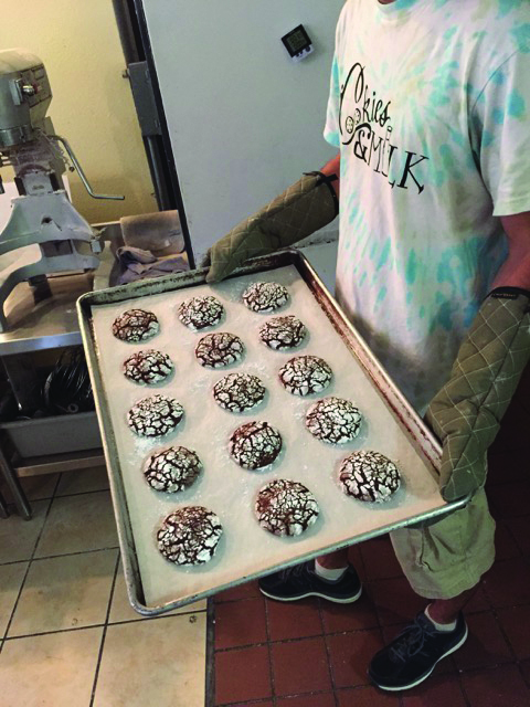 Nick Altman prepares the freshly-baked cookies for the final stage before delivery. Photo by MJ Ongoy | Staff Writer thatswhatmjsaid@gmail.com