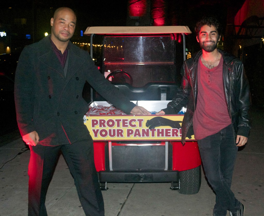Lincoln Scott and Sandeep Singh of the Student Associated Council stand by the safe-sex golf cart, which is designed to help raise awareness about AIDS/HIV protection. Photo by Gabrielle Smith | Photo Editor | gsmithexpress@gmail.com