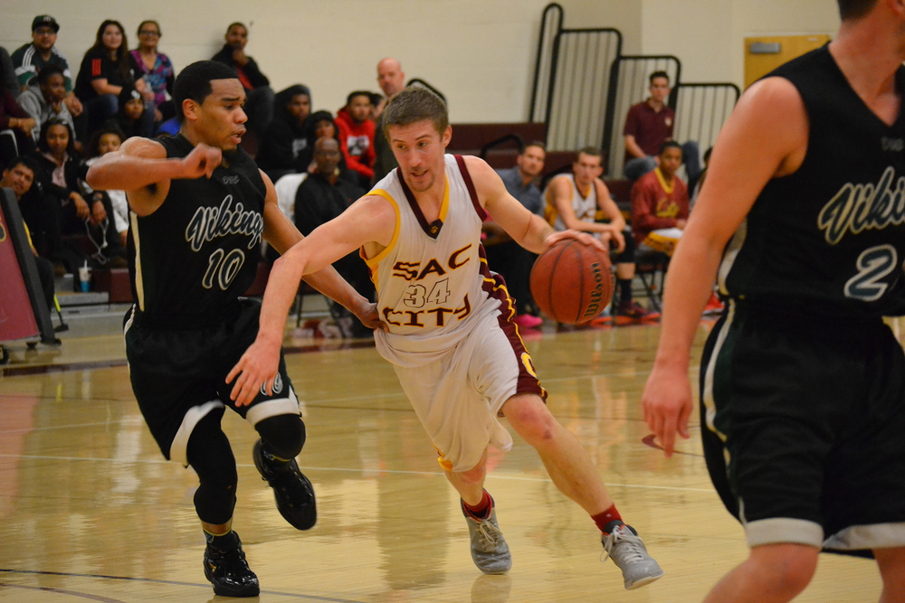 Sophomore Adam Ciszewski rushes his opponent toward the hoop for a successful shot for the Panthers during their game against the Diablo Valley Vikings.
Gabrielle Smith | Photo Editor | gsmithexpress@gmail.com