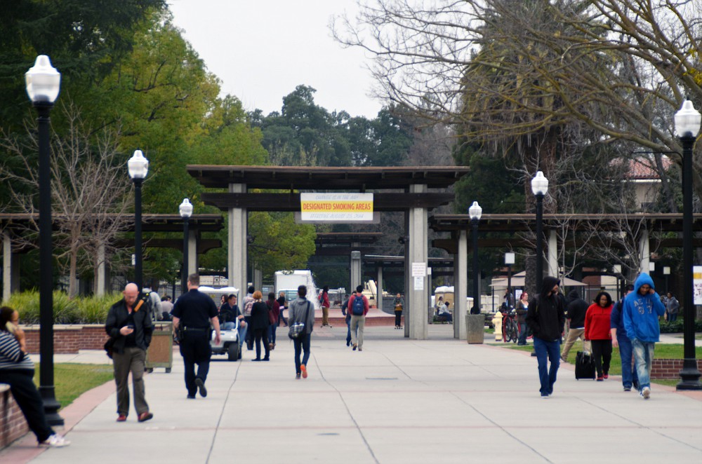 City College students on the walkway near the fountain at the center of campus. Christopher Williams | Staff Photographer