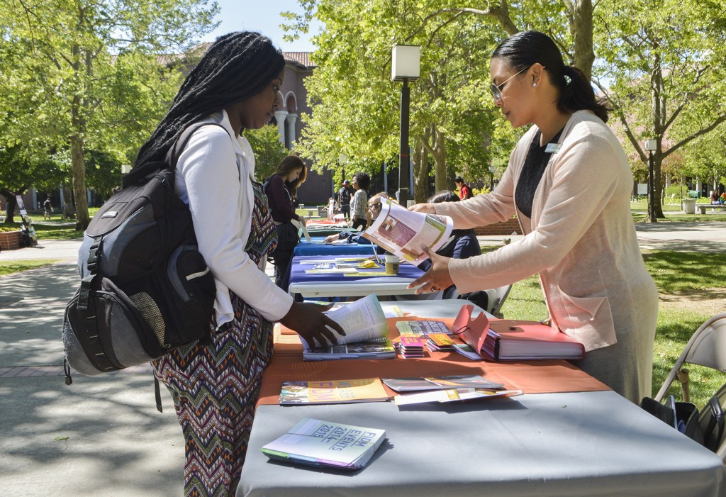 College representative for Fashion Institute of Design & Merchandising, Jennifer Nordora, explains the class schedule and living situations to City College student Kronnisha Smith who is transferring in Fall 2015. Emily Foley | Photo Editor | emmajfoley@gmail.com