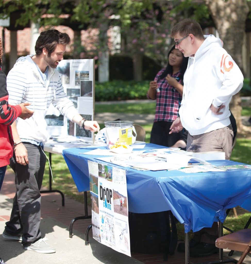 City College communications student Nick Caruso (left) and chemistry student Brandon Hord take a break from distributing information about the drought in California at City College on April 22, 2015.  Vanessa Nelson | Staff Photographer