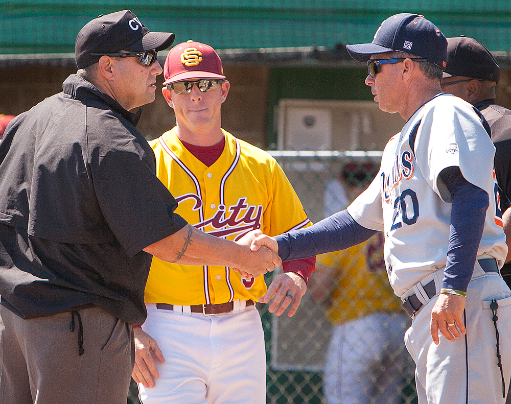 Gotlibe second base umpire shakes hands with Tony Bloomfield (right) head coach for Consumnes River College while City College head coach Derek Sullivan watches before the game at Union Stadium on April 14th.

Dianne Rose / dianne.rose.express@gmail.com
