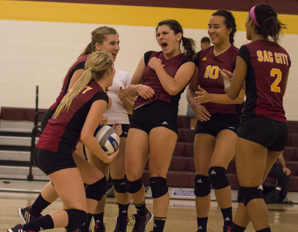 Panthers volleyball players celebrate after scoring the 24th point of the third set in the first match of the Quad event Sept. 18, 2015.
Kristopher Hooks | Editor in chief | khooksexpress@gmail.com