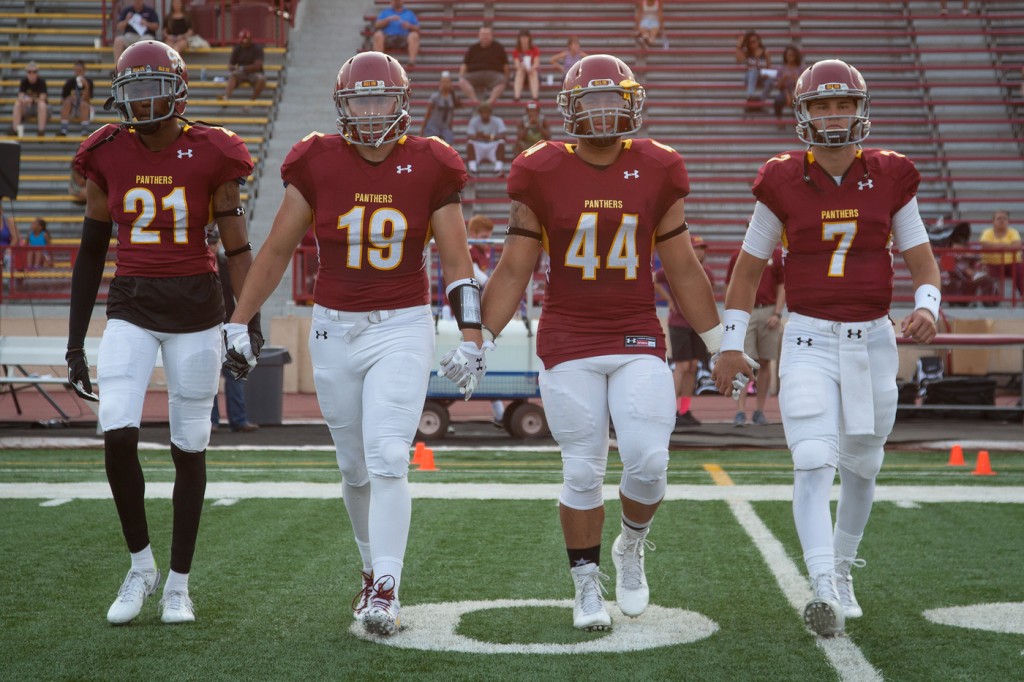 City College football captions Aaron Ross, Ryan Staas, Leonard Skattebo and Jason Samuels walk out for the coin toss at center field before the home opener against Foothill College at Hughes Stadium on Sept. 11, 2015.  Photos by Dianne Rose