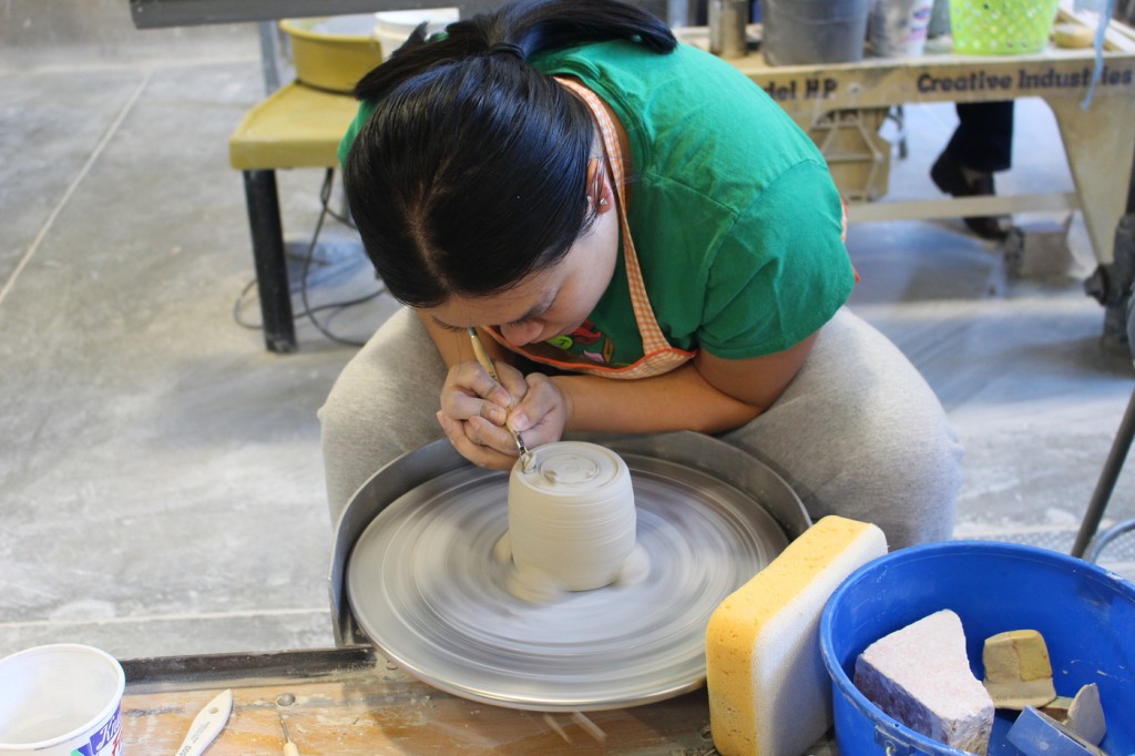 City College student Samantha Hui, Psychology major, trimming her ceramic cup in Introduction Ceramics November 18, 2015. Photo by Julie Jorgensen | juliejorgensenexpress@gmail.com