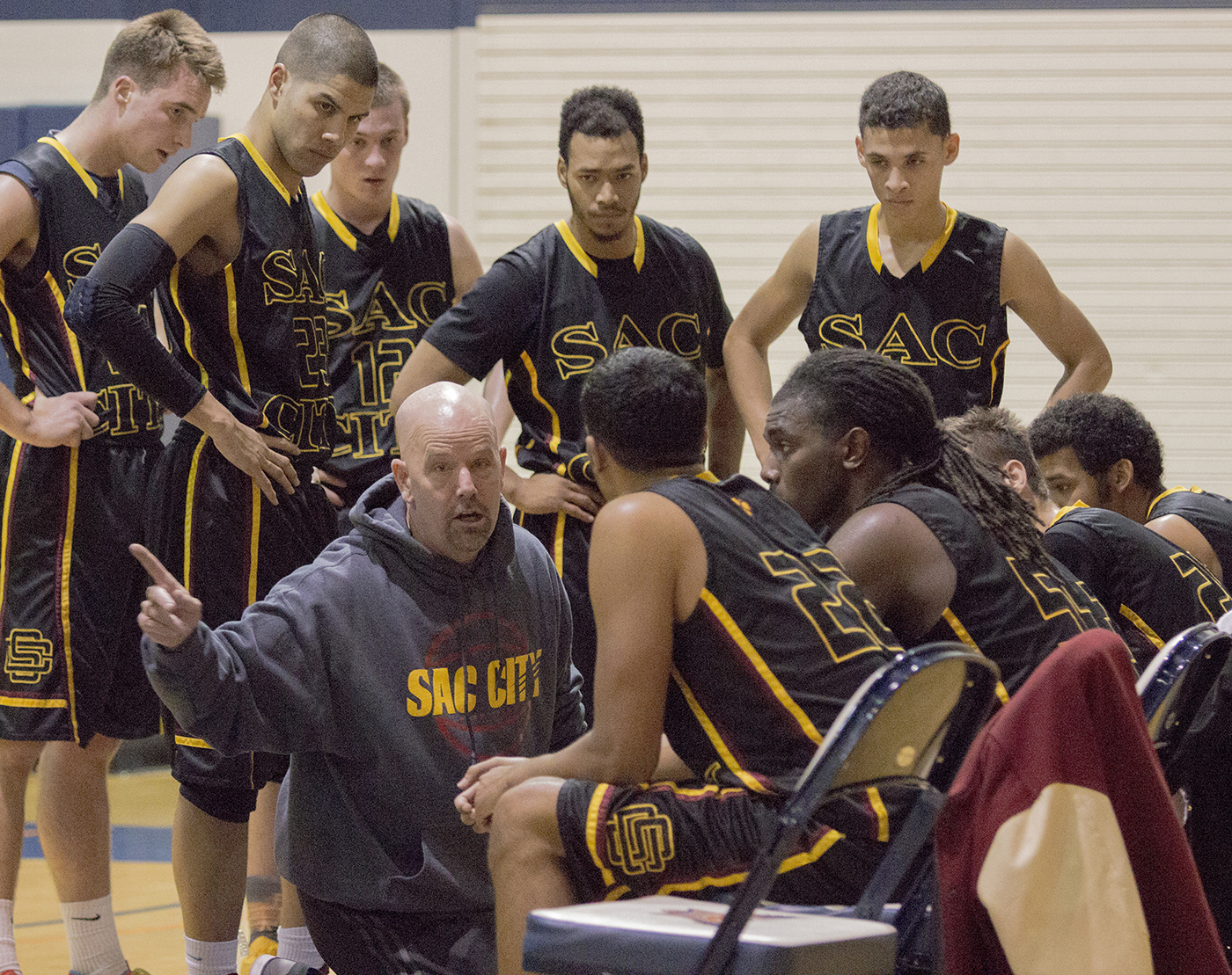 City College head coach Andrew Jones talks to his team during a timeout in the first half of the game against Feather River College Dec. 3. Photo by Kristopher Hooks | khooksexpress@gmail.com