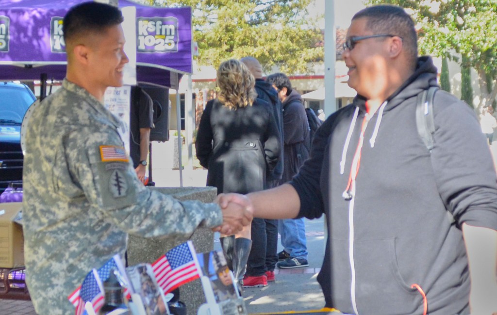 Recruiter from the US Army Staff Sergeant Nguyen talking with City College student Micheal Phan accounting major about what the US Army could offer him if he joins the US Army. 