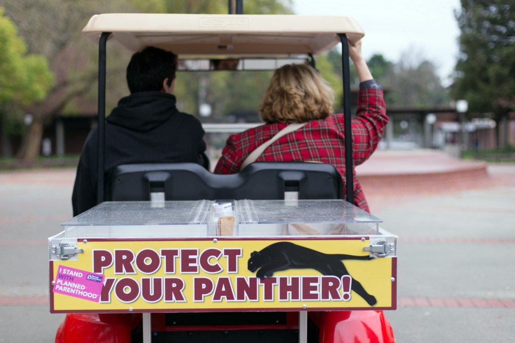 City College student Kevin Porta, business major, and Psychology Professor Patty Blomberg rides in the Condom Connection cart passing out free condoms. Hector Flores, Staff Photographer. | hectorfloresexpress@gmail.com
