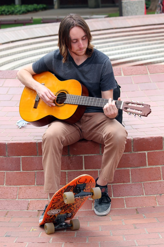 City College student Kevin Werre, biology major, playing a guitar in the Quad before heading to his next class. Julie Jorgensen, Photo Editor. | juliejorgensenexpress@gmail.com